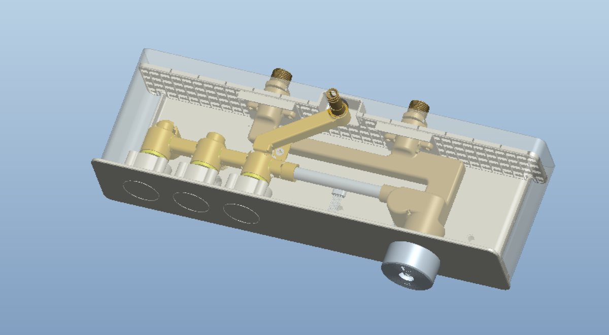 PTC Creo 3D assembly of an in-wall concealed shower system, housing shown semi-transparent, revealing the brass hot and cold valve block, waterways, three push-button openings and the handwheel