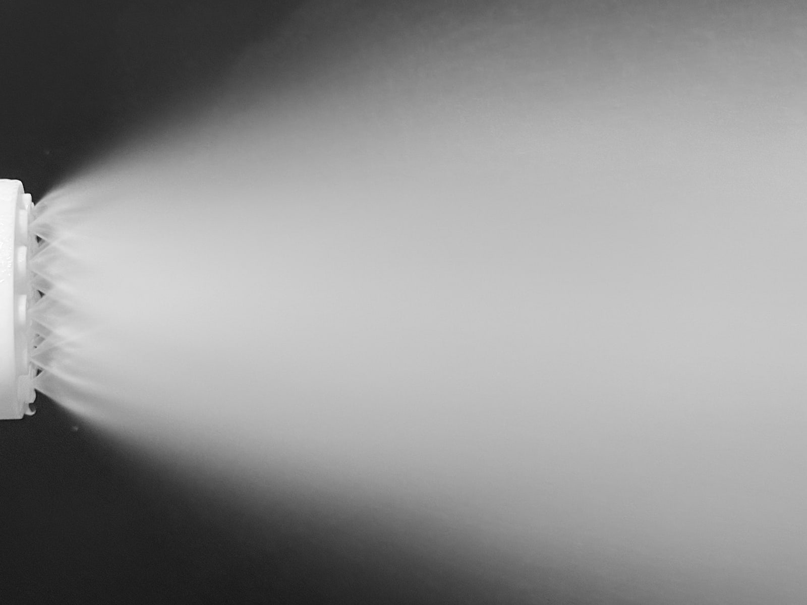 Fine mist fanning out from a 3D-printed prototype disc in a spray test